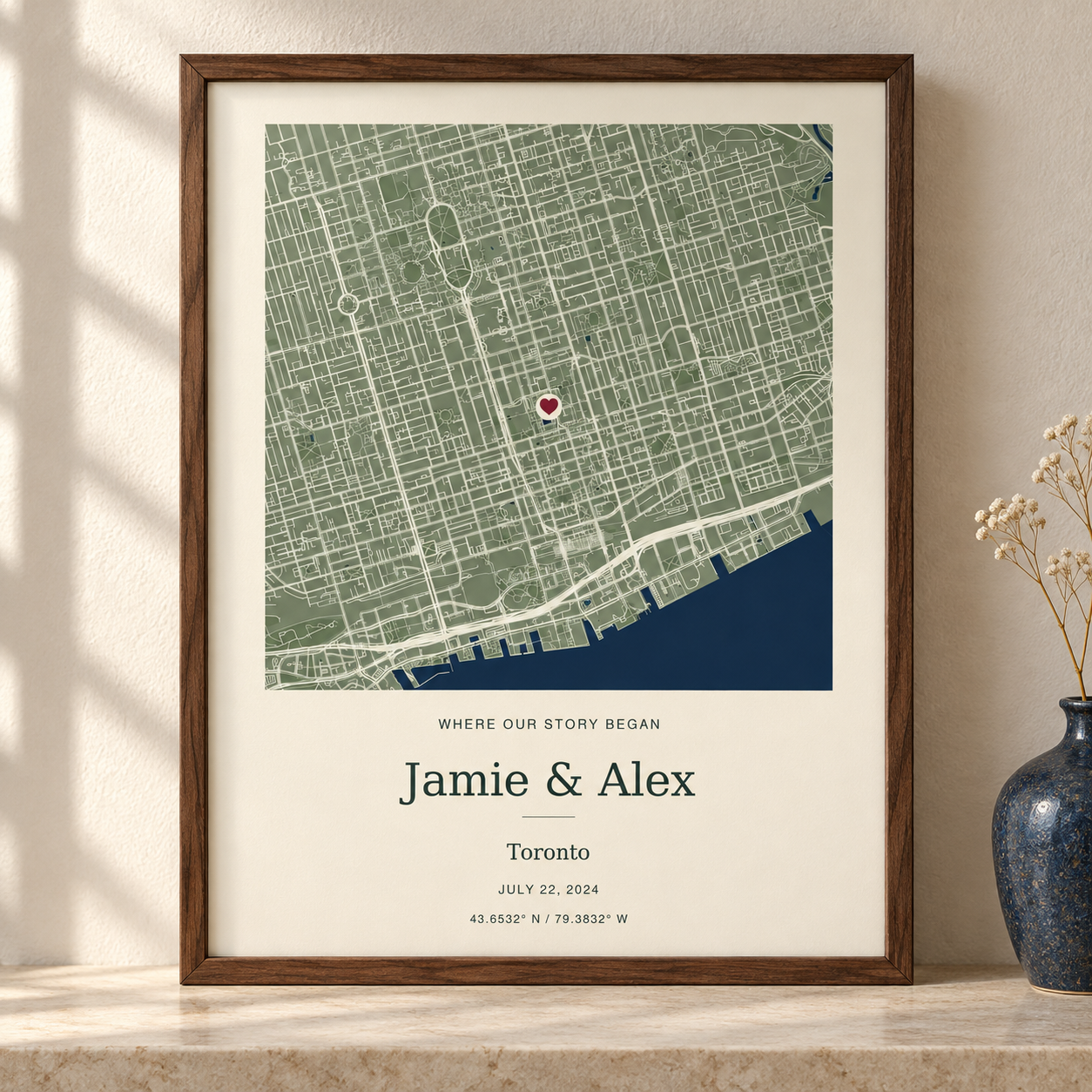 Earth-style personalized map with a cream page and deep red heart, displayed in a walnut frame
