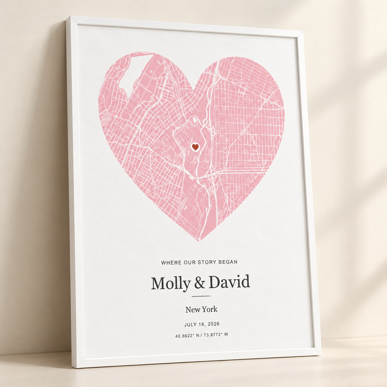 Realistic product mockup of the rose heart map personalized for Molly and David, in a white frame against a sunlit wall